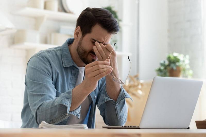 Man suffering from dry eyes