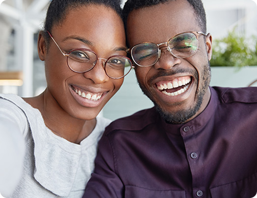 Couple wearing glasses smiling