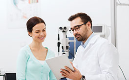 Doctor explaining eye health test to patient