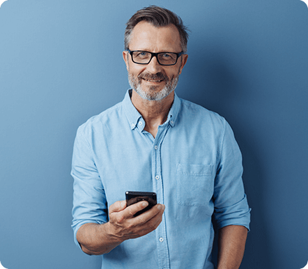Man wearing glasses using smartphone