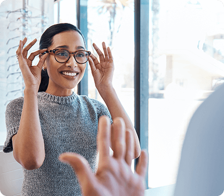 Woman trying on eyeglasses at Washington Eye Doctors