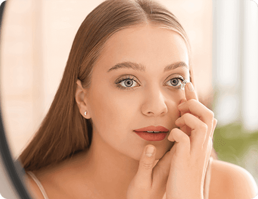 Woman putting on scleral lenses at Washington Eye Doctors