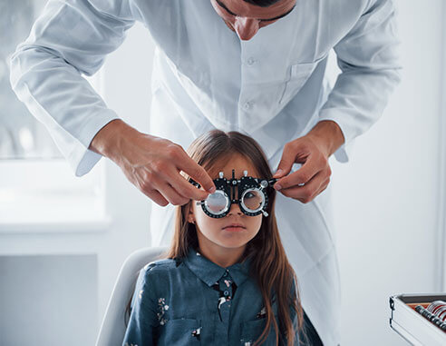 Little girl getting pediatric eye exam from Washington Eye Doctors