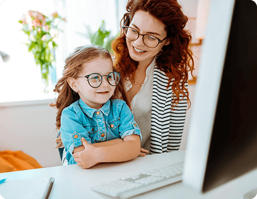 Mother and daughter wearing blue light protection glasses