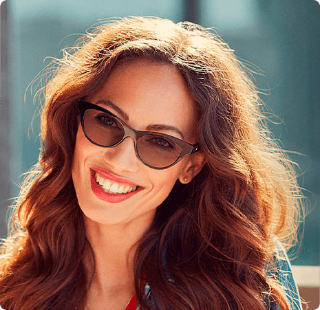 Woman smiling wearing transition lenses