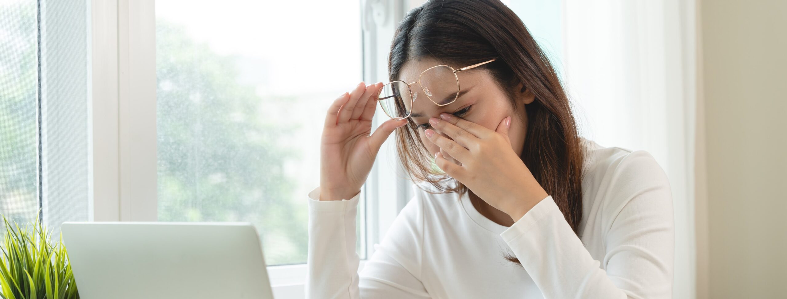 “Person with watery, irritated eyes caused by dry eye disease, shown in an article from Washington Eye Doctors serving DC, Chevy Chase, and Arlington.”